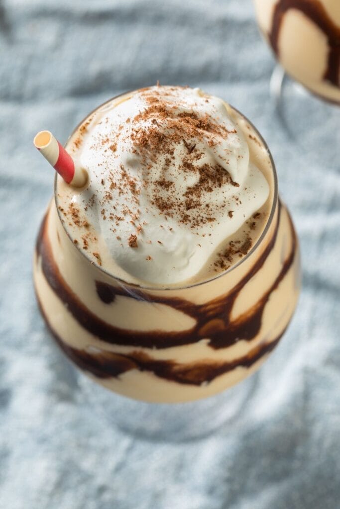 Boozy Frozen Mudslide topped with Whipped Cream and Cocoa Powder