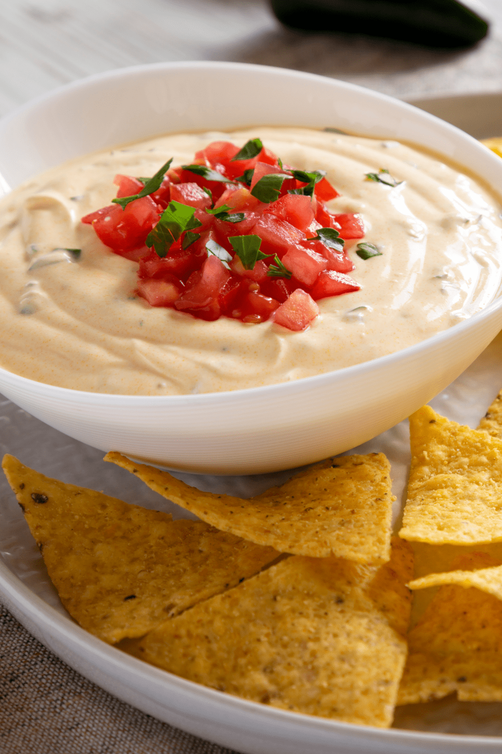 Queso Dip with Chopped Tomatoes and Tortilla Chips