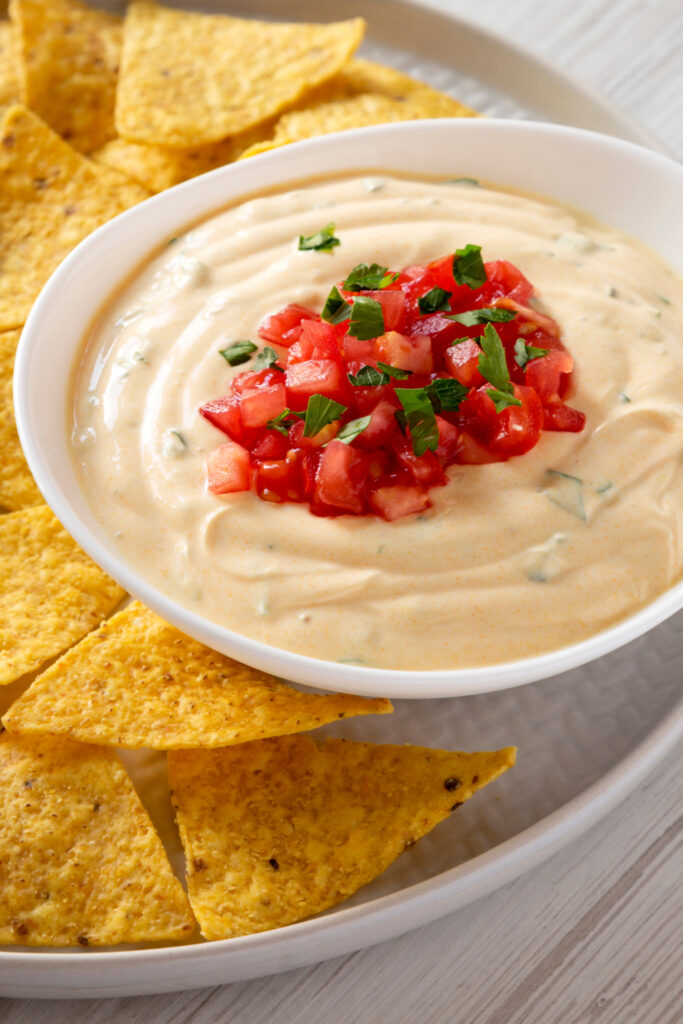 Cheesy Dip with Tomatoes and Tortilla Chips