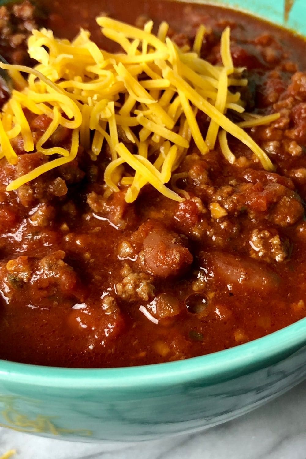 Chili Dip with Ground Beef and Cheese in a Bowl
