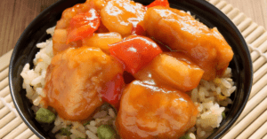 Egg Fried Rice Topped with Sweet and Sour Chicken Balls