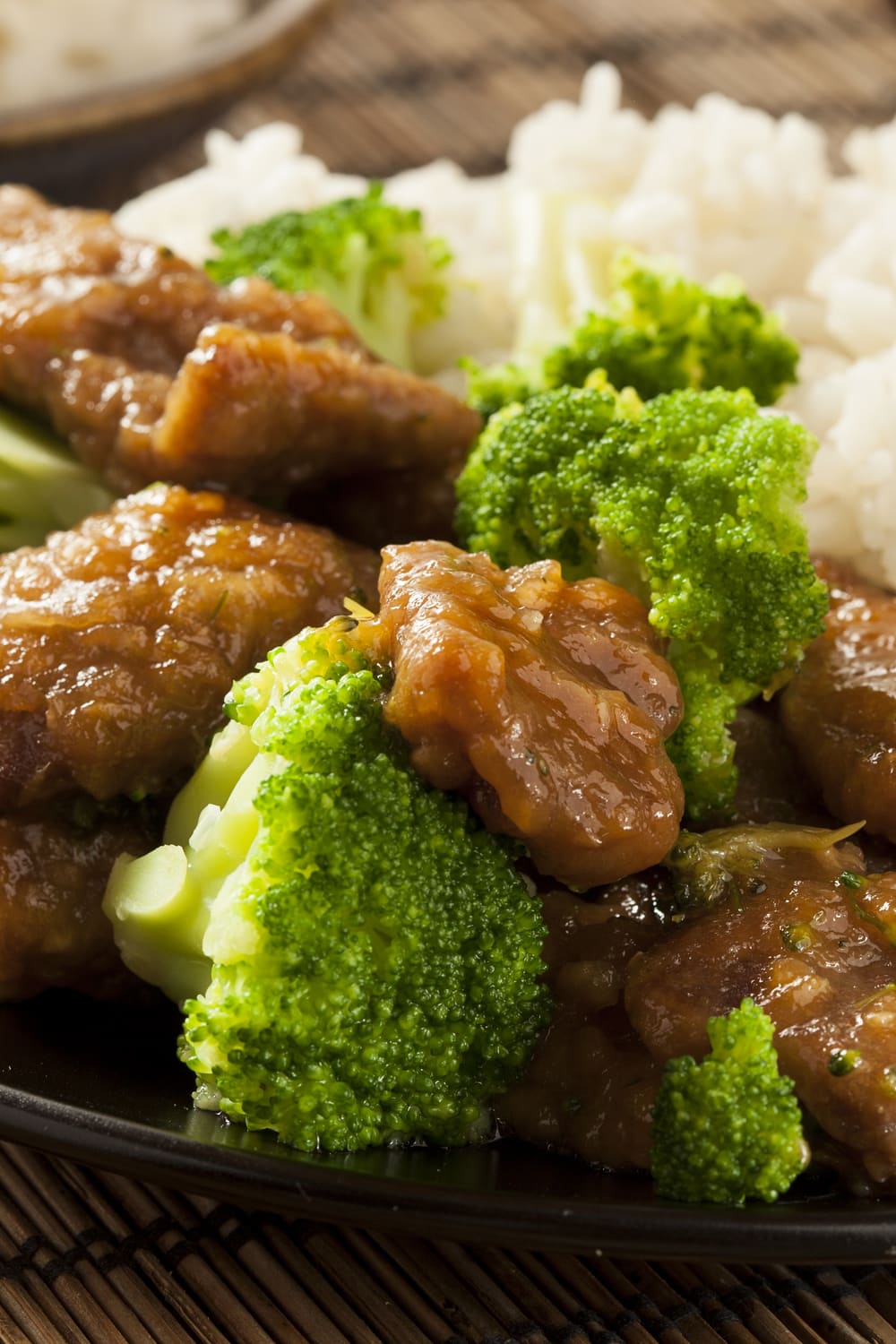 Beef and Broccoli with sauce served with white rice.