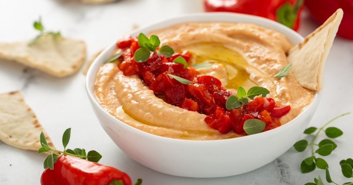 Bowl of Hummus with Red Pepper and Pita Chips