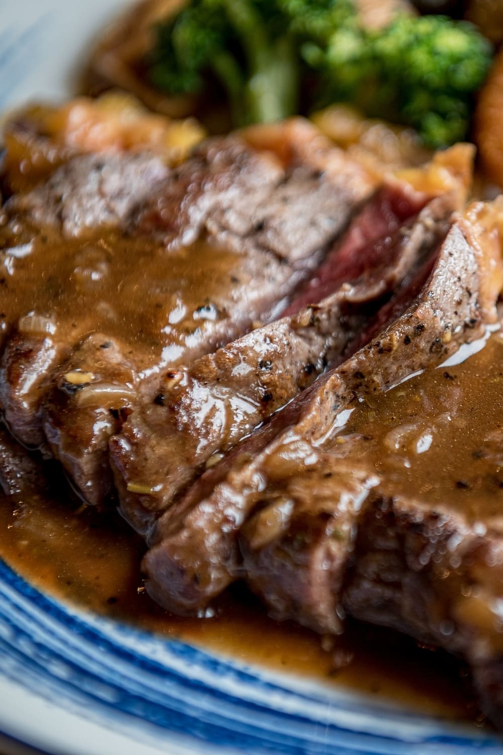 Sliced grilled sirloin tip steak poured with gravy. 