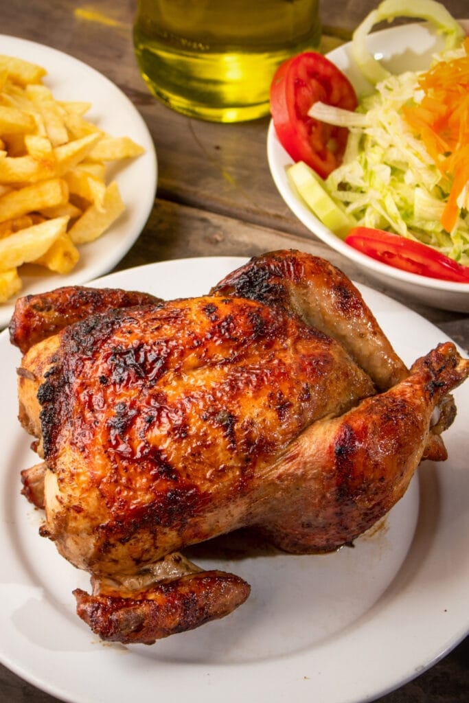 Peruvian Roasted Chicken with French Fries and Veggie Salad