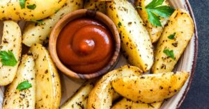 Baked Potato Wedges with Ketchup and Herbs