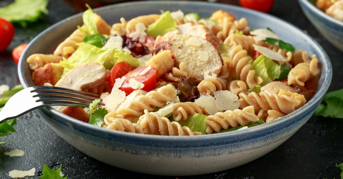 Caesar Salad Pasta with Chicken, Tomatoes and Cheese