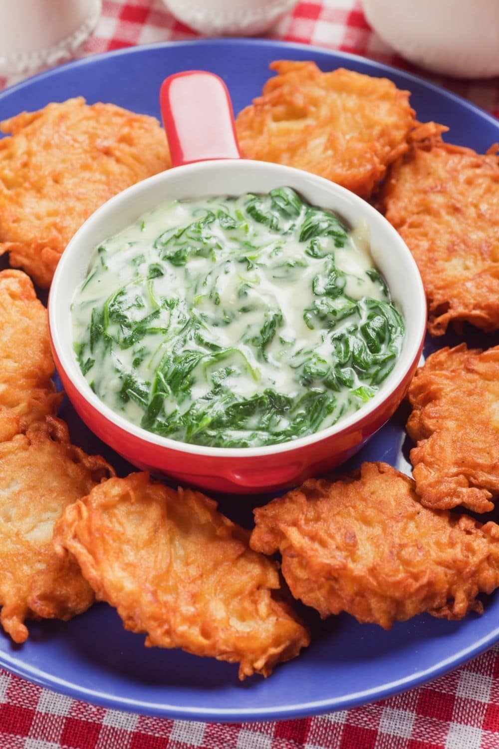 Creamy spinach soup with potato pancakes