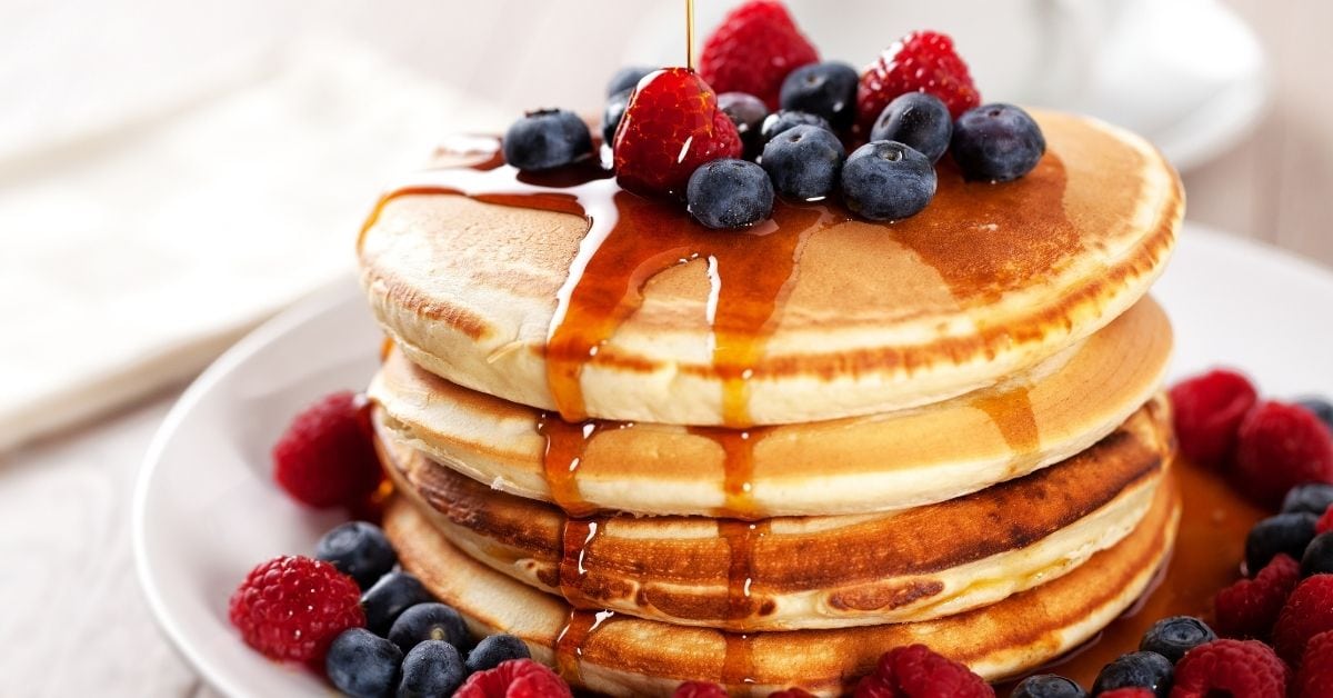 Fluffy Pancakes with Berries and Maple Syrup