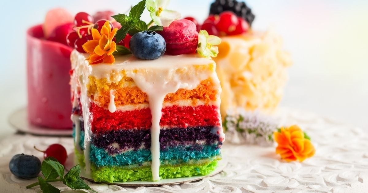Homemade Colorful Rainbow Cake with Berries and Sugar Icing