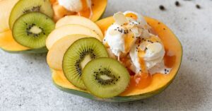 Homemade Papaya Boat Dessert with Ice Cream and Fruits