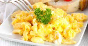 Homemade Scrambled Eggs with Bread and Parsely