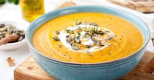 Pumpkin and Carrot Soup with Pumpkin Seeds and Cream