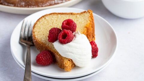 Slice of Homemade Pound Cake with Fresh Strawberries and Whipped Cream