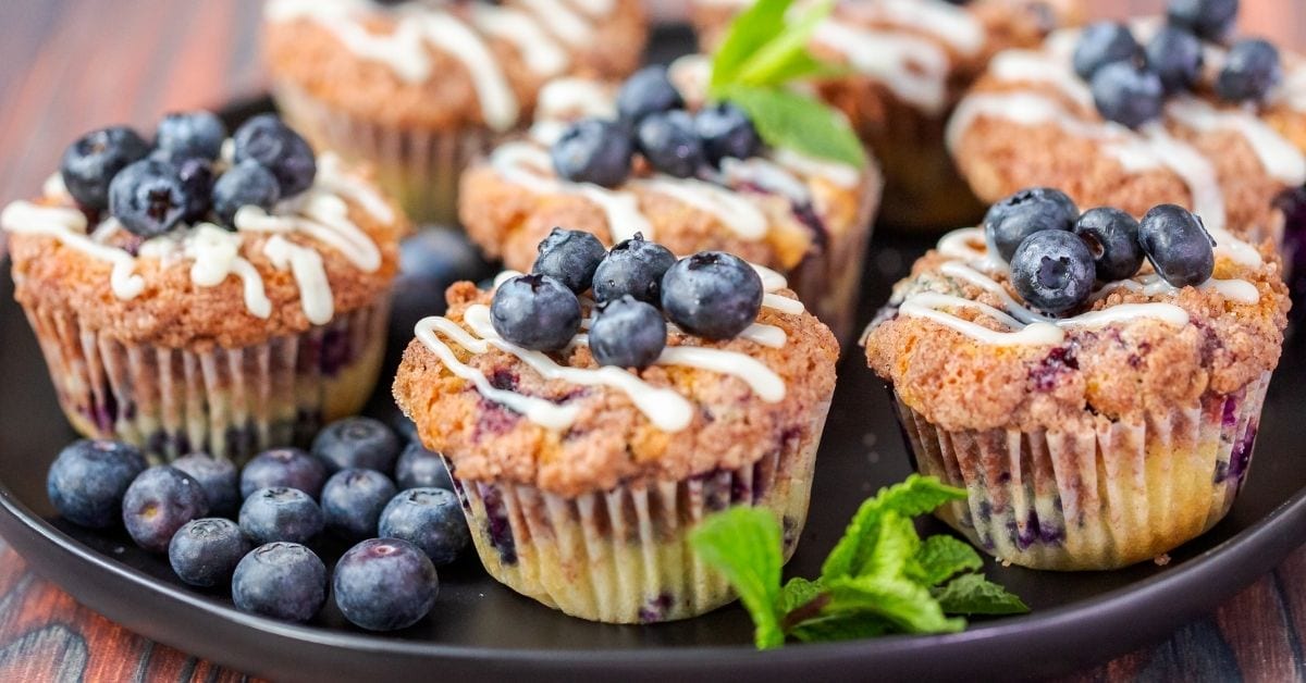 Blueberry Muffins with Vanilla Frosting and Fresh Blueberries