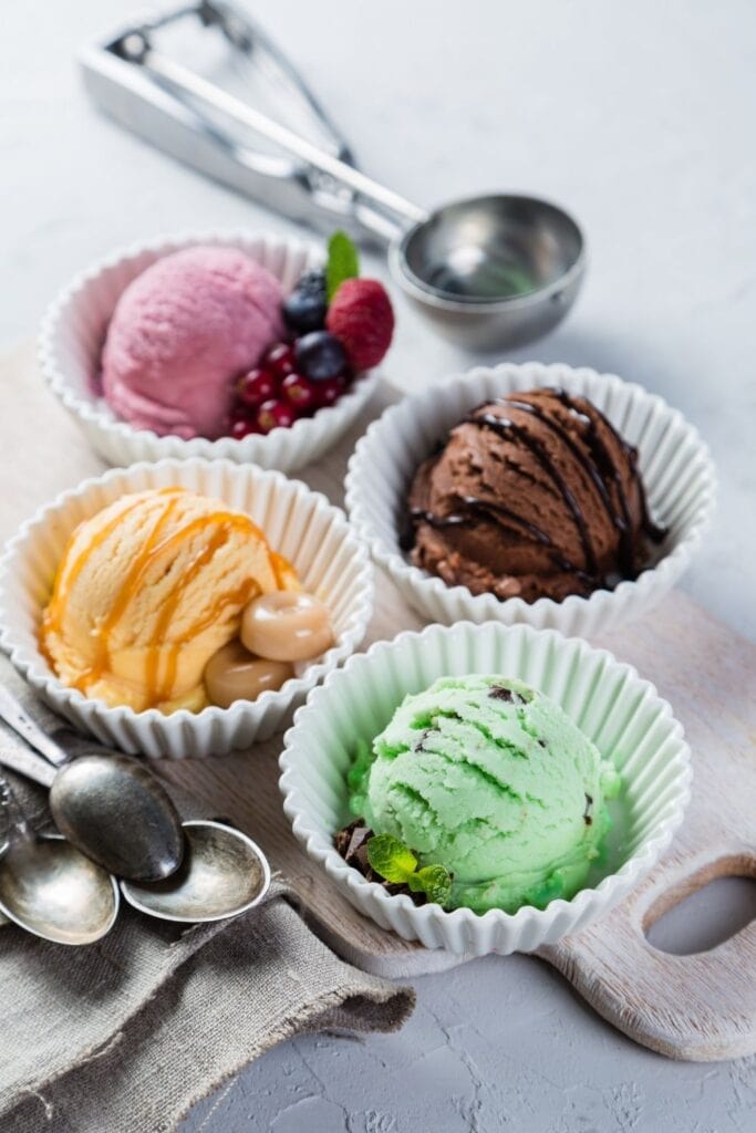 Colorful Ice Cream Scoops: Chocolate Mint, Chocolate, Mango and Berry Flavors