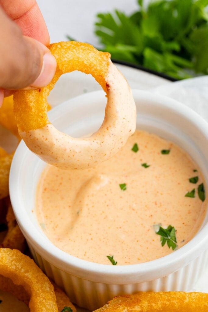 Dipping an Onion Ring on a Homemade Burger King Zesty Sauce