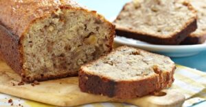 Homemade Banana Bread with Nuts Sliced in a Chopping Board