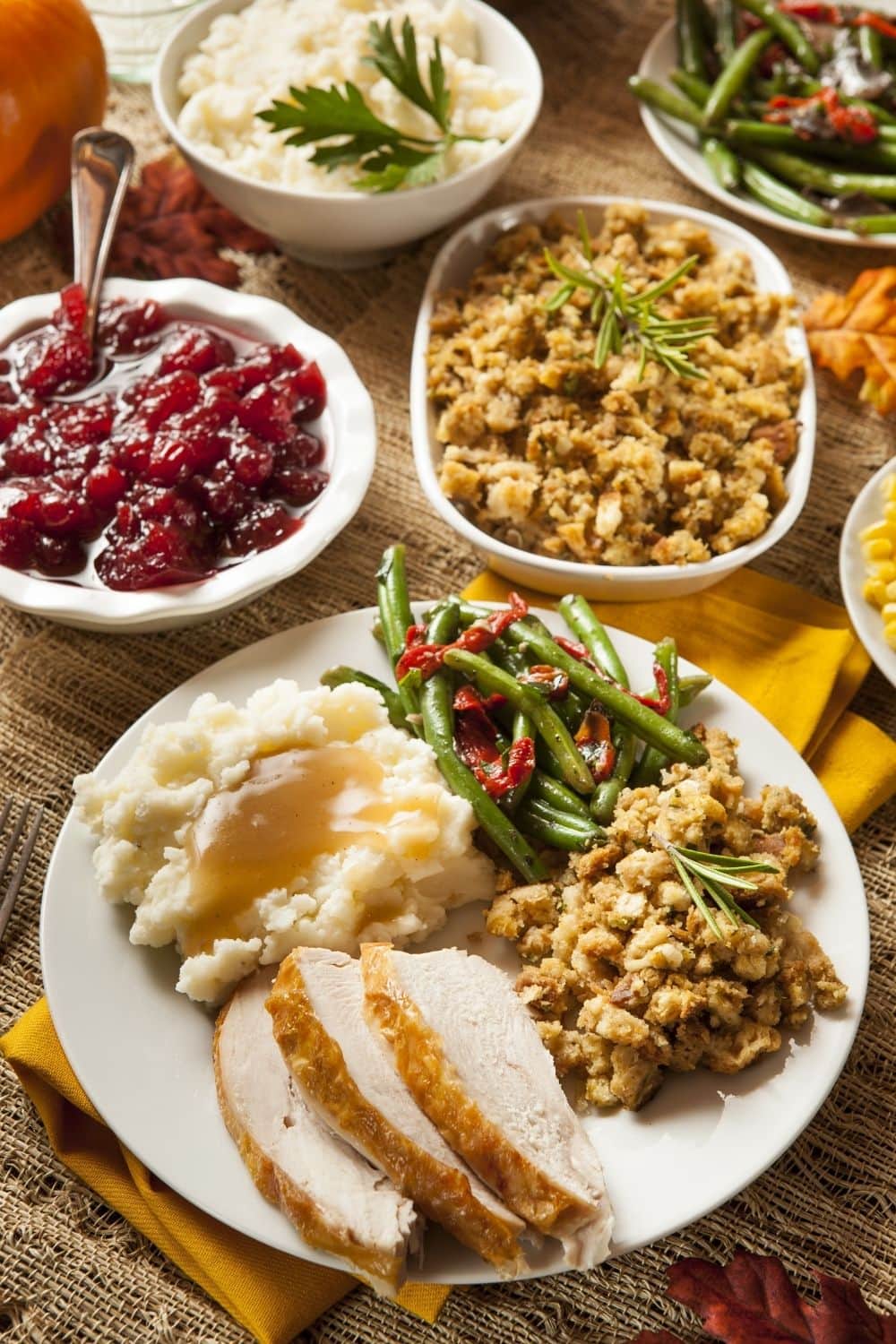 Homemade Thanksgiving Dinner with Stuffing, Turkey, Mashed Potatoes and Cranberry Sauce