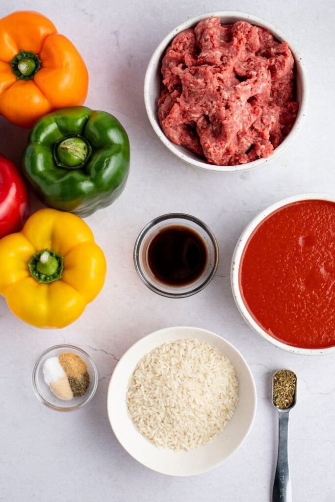 Stuffed Bell Peppers Ingredients: Rice, Bell Peppers, Ground Beef, Tomato Sauce and Seasonings