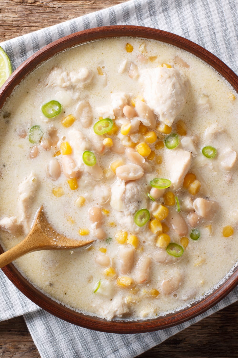Bowl of White Chicken Chili Made With White Soup, Chicken Meat, Corn and Green Chilis