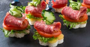 Appetizing Canape with Sausage and Vegetables on Skewers