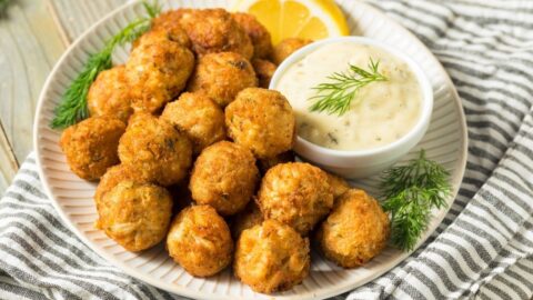 Appetizing Mini Crab Cake Balls with Dipping Sauce and Lemons