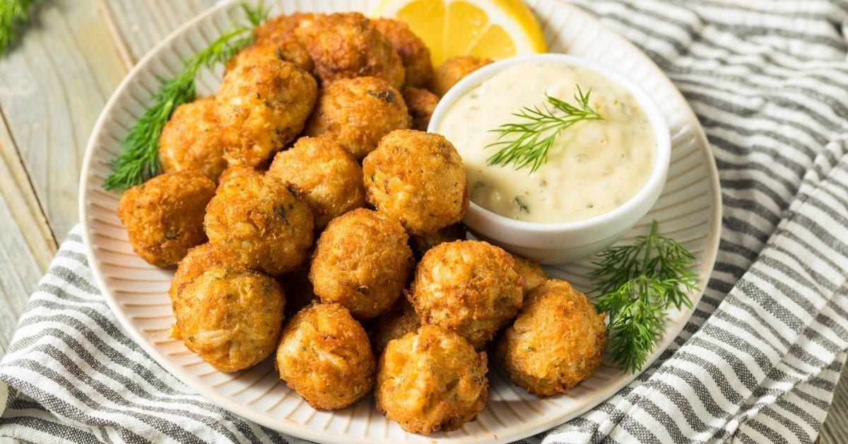 Appetizing Mini Crab Cake Balls with Dipping Sauce and Lemons