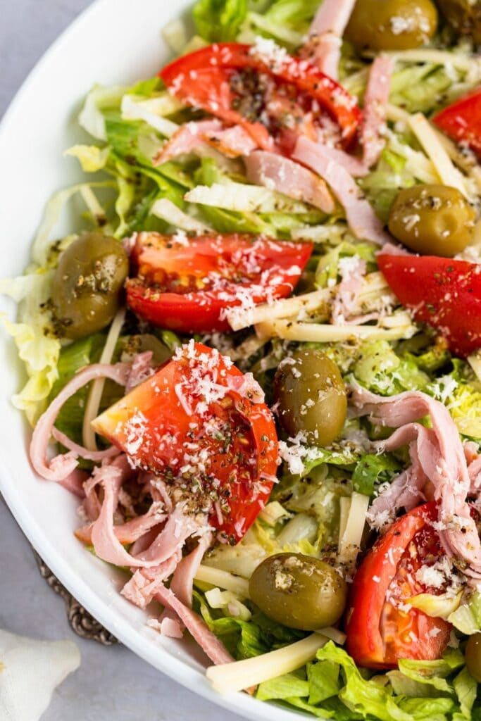 Bowl of 1905 Salad with Shredded Lettuce, Tomatoes, Olives and Ham