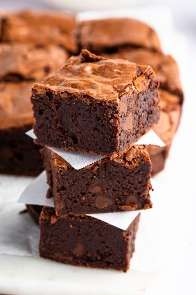 Three Chewy and Gooey Godiva Chocolate Brownies stacked on top of each other