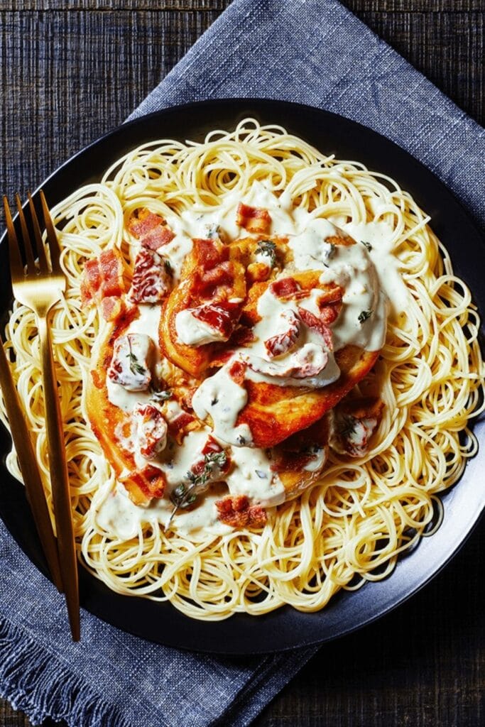 Chicken Breast Served with Al Dente Angel Hair Pasta and Cream Sauce