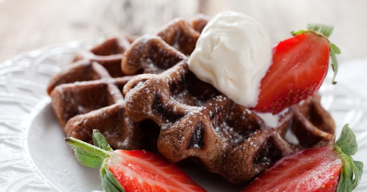 https://insanelygoodrecipes.com/wp-content/uploads/2021/09/Chocolate-Waffles-with-Ice-Cream-and-Fresh-Strawberries.jpg