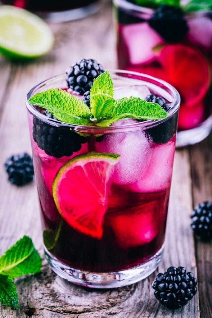 Cold Purple Blackberry Mojitos with Fresh Berries