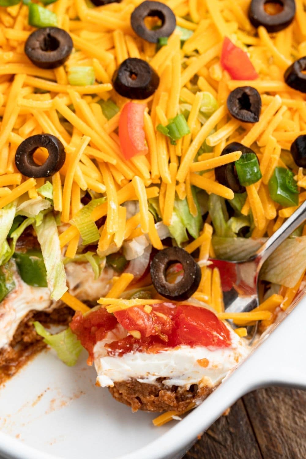 Homemade Seven Layer Taco Dip with Black Olives, Tomatoes and Onions