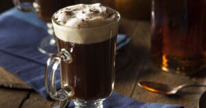 Homemade Irish Coffee with Whipped Cream in a Glass