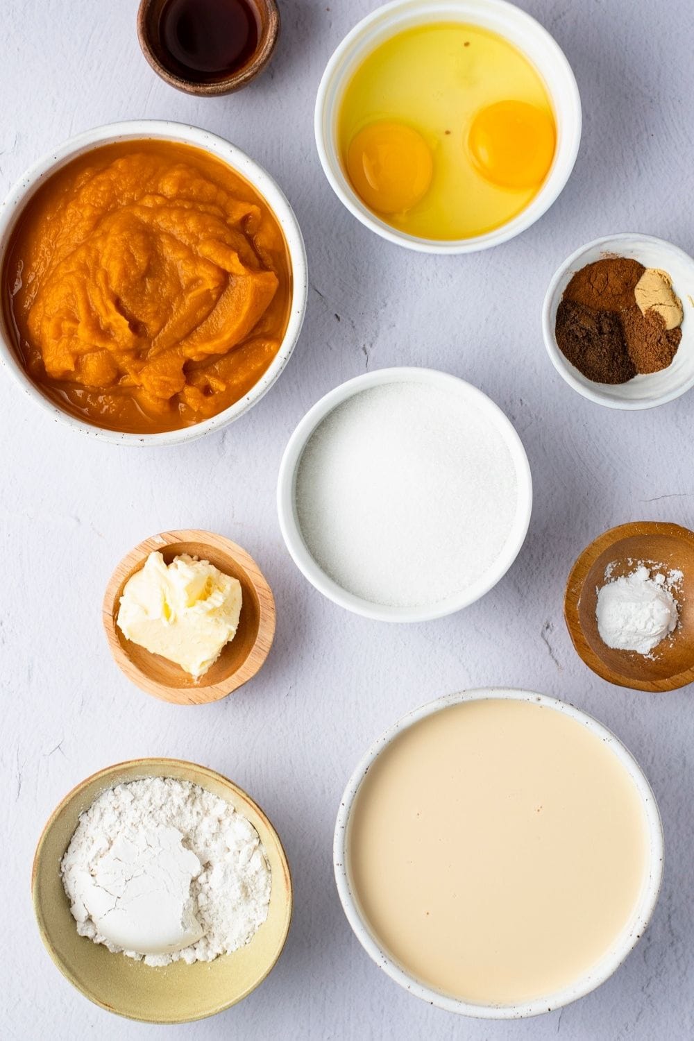 Impossible Pumpkin Pie Ingredients: Pumpkin Puree, Eggs, Butter Spices, Evaporated Milk, and Ground Nutmeg