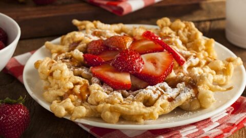 Sweet Funnel Cakes with Strawberries and Powdered Sugar