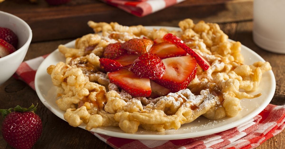Sweet Funnel Cakes with Strawberries and Powdered Sugar