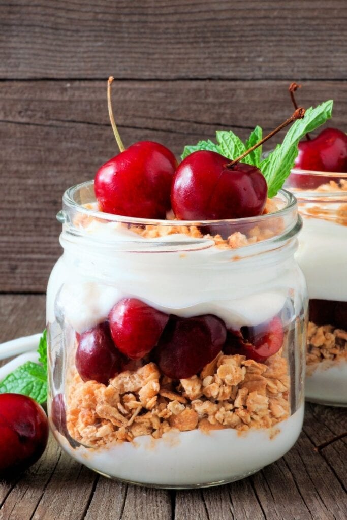 Yogurt Parfait with Cherries in a Mason Jar