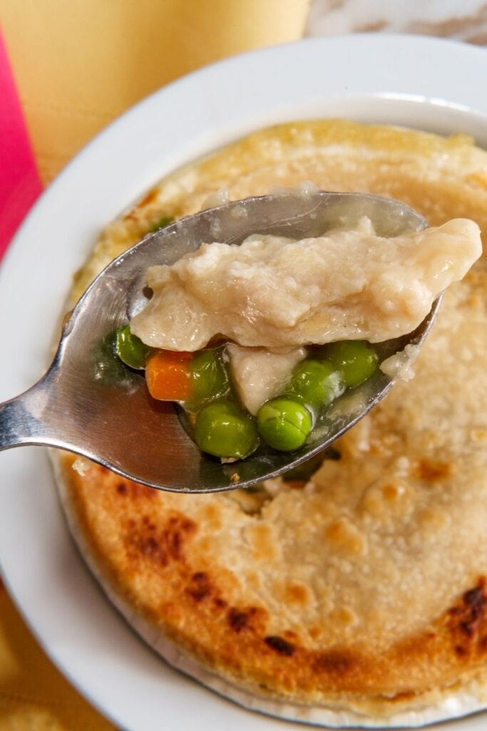 A Scoop of Cooked Turkey with Green Peas