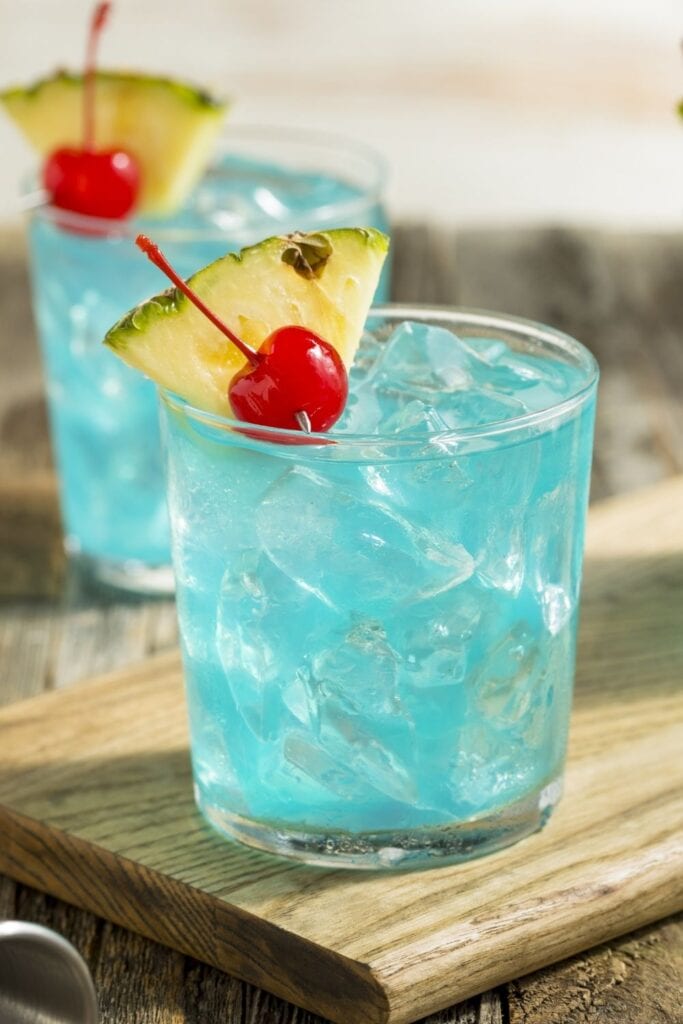 Blue Hawaii Cocktail Punch with Pineapple and Cherry