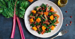 Boiled Swiss Chard with Sweet Potatoes and Pomegranate in a Plate