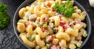 Bowl of Elbow Pasta Salad with Onions and Bell Peppers