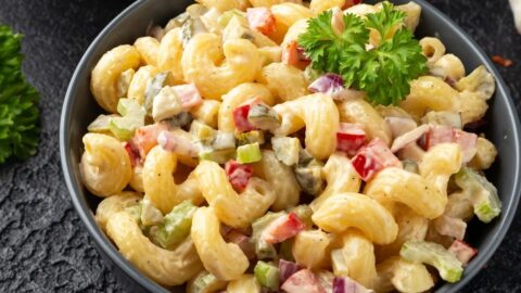 Bowl of Elbow Pasta Salad with Onions and Bell Peppers