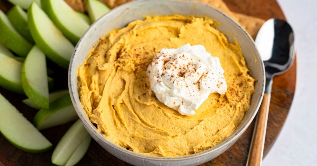 Bowl of Creamy Pumpkin Fluff Dip with Whipped Cream