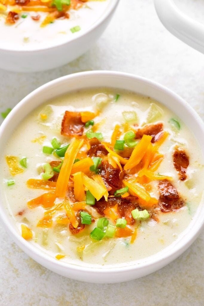 Bowl of Homemade Creamy Potato Soup with Cheese, Onions and Bacon Bits
