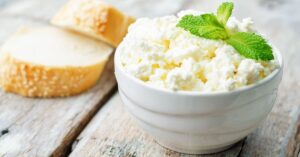 Bowl of Homemade Ricotta Cheese with Bread
