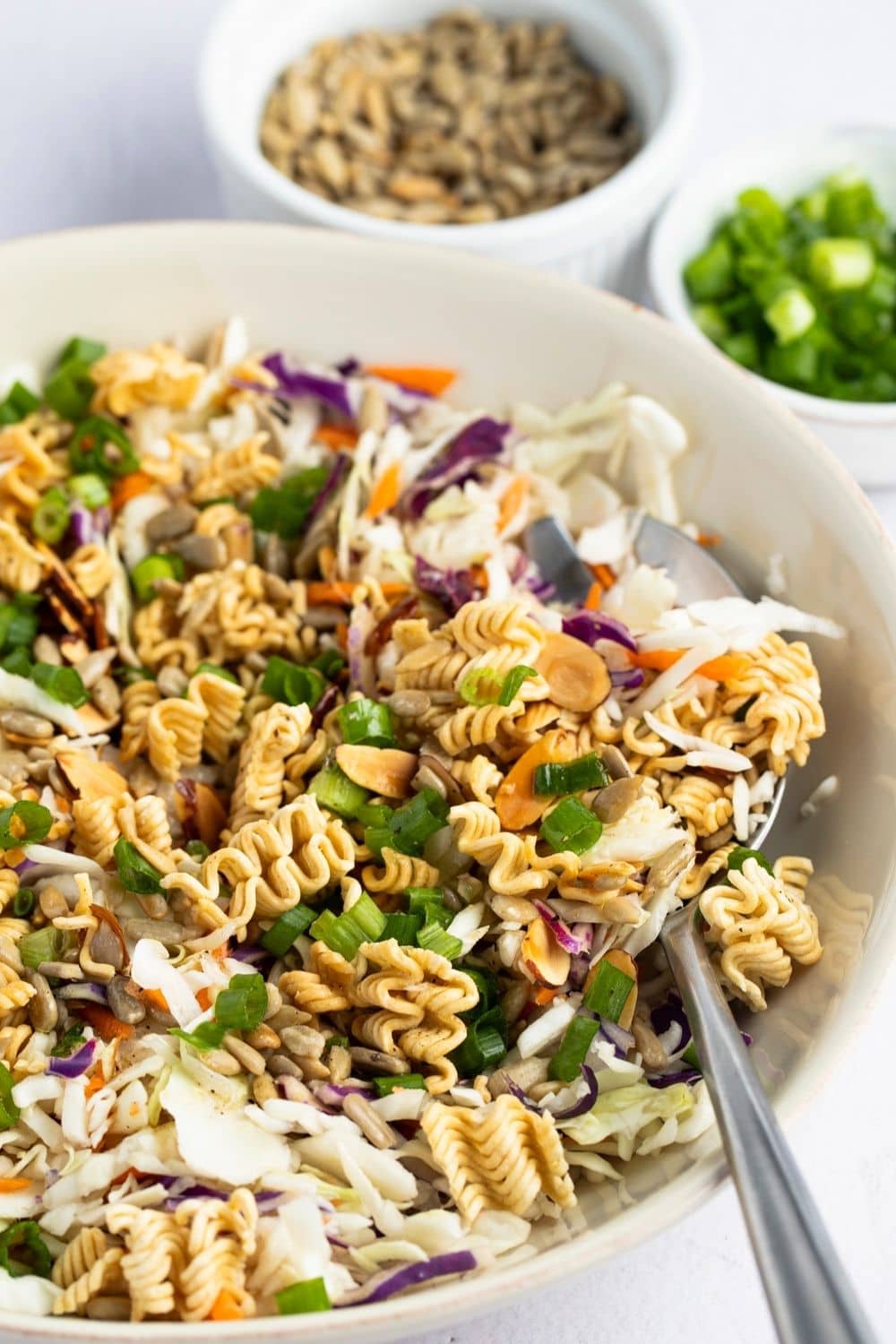 Ramen noodle salad with shredded cabbage, carrots, almond slivers and sunflower seeds.