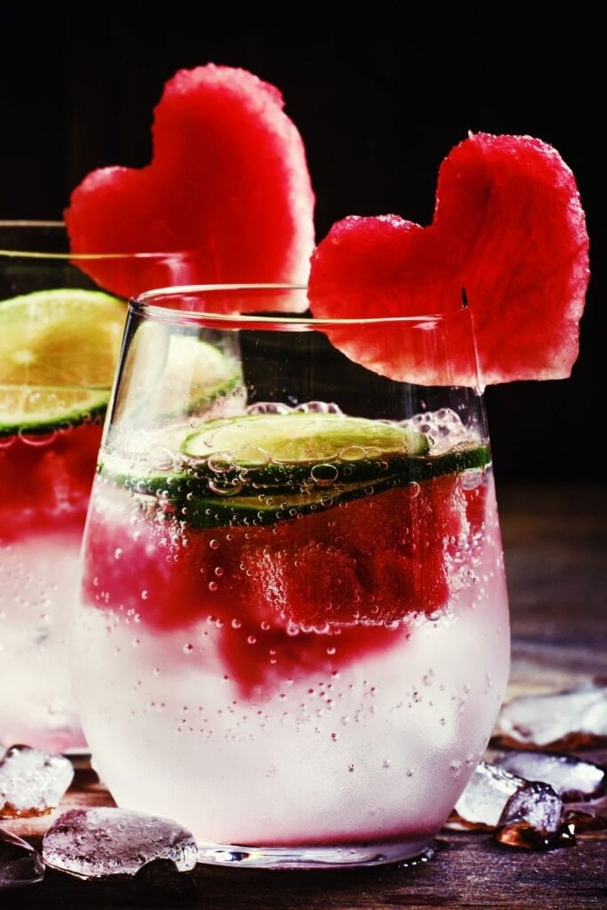 Cold Valentine's Day Cocktail with Lime and Heart-Shaped Watermelon