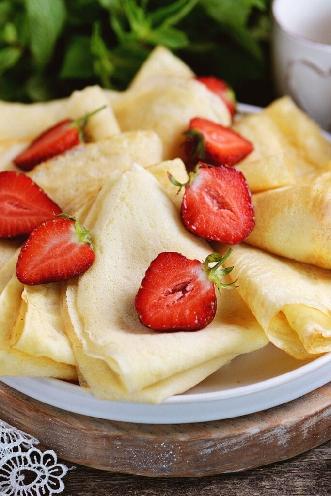Crepes Made of Chickpea Flour with Fresh Strawberries